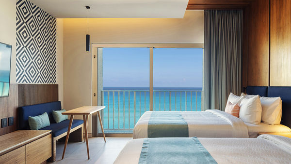 A double bed balcony beachfront guestroom at the Hilton Cancun Mar Caribe All-Inclusive Resort, which will open in November.